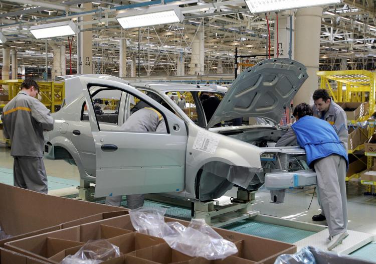 Employees of the Avtoframos automobile plant assemble a Renault Logan model in Moscow. Russia is one of the hardest-hit by the global economic crisis, causing the country to plunge into its first recession since 1998. (Alexander Nemenov/AFP/Getty Images)