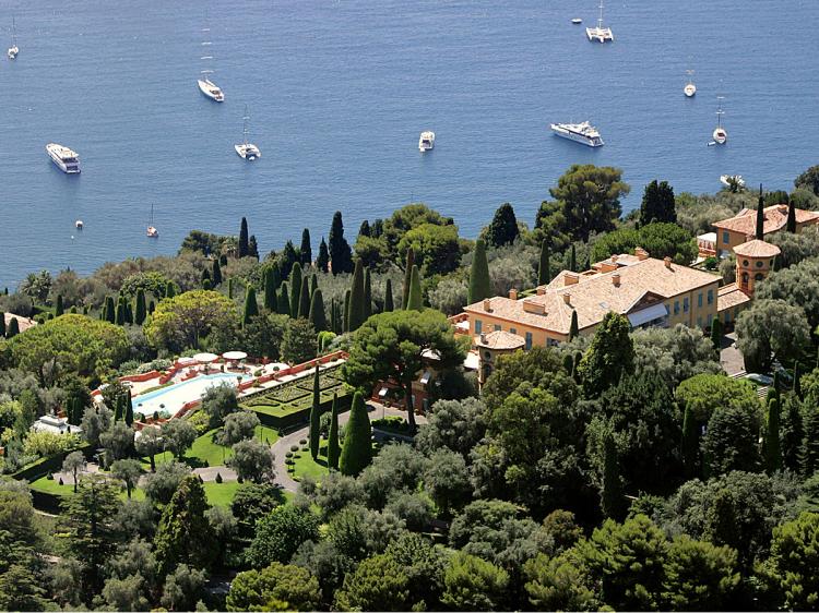 SPRAWLING: Leopolda estate, in Villefranche-sur-Mer, French Riviera, August 2008. The estate was sold to Russian billionaire Mikhail Prokhorov for € 370 million (US$503.6 million), plus € 19.5 million (US$26.5) for the furniture in August 2008 but later the Russian magnate refused to clinch the deal. Originally built by King Leopold II of Belgium at the beginning of 1900, the cream-colored villa is set in 20 acres of gardens overlooking Cap Ferrat, near Villefranche-sur-Mer. (Eric Estrade/AFP/Getty Images)