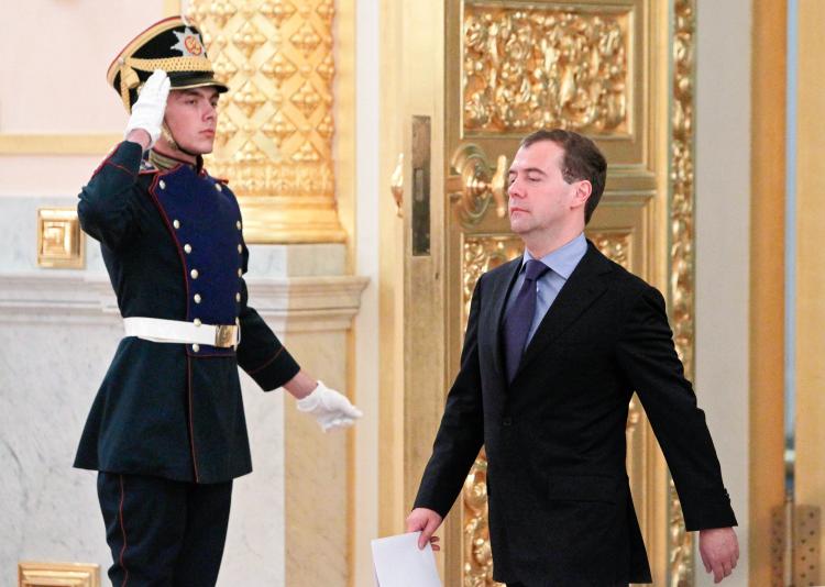 TIGHT GRIP: Russia's President Dmitry Medvedev (R) on his way to attend a session of the National Projects Council in the Kremlin, Moscow, on July 29. Medvedev signed a bill on Thursday giving Russia's security service greater powers.  (Denis Sinyakov/Getty Images)