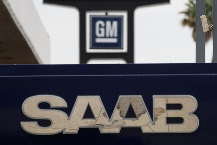 Saab and GM signage is seen at the Symes auto dealership lot, after it was announced that General Motors is selling Saab, on June 16, 2009 in Pasadena California. (David McNew/Getty Images)