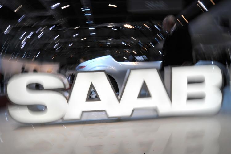 A logo of the Swedish car manufacturer Saab owned by General Motors is displayed during the 79th Geneva Car Show on March 3 in Geneva. Saab faces an uncertain future as its market share drops and parent General Motors struggles to survive. (Fabrice Coffrini/AFP/Getty Images)
