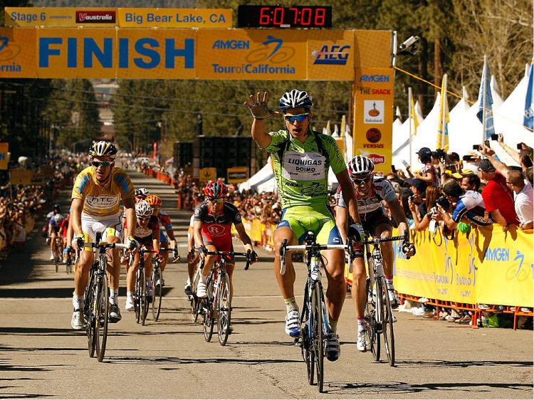 Peter Sagan holds up five fingers, denoting five race wins in 2010, as he crosses the finish line first in Stage Six of the Amgen Tour of California. (Chris Graythen/Getty Images)