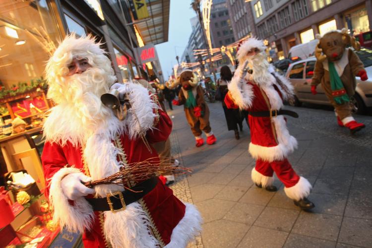 'Santa Claus-free zones' were requested by a Catholic group this week, media reports say. Pictured above, actors dressed as Santa Claus and reindeer greet shoppers outside a department store on December 11, 2008 in Berlin, Germany.  (Sean Gallup/Getty Images)