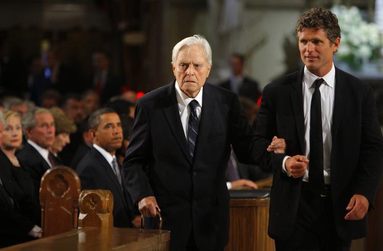 Sargent Shriver, former JFK aide and Peace Corps founder, died Tuesday at the age of 95. Above, Shriver (L) is accompanied by his son Anthony Kennedy Shriver (R) at the funeral services of Senator Edward Kennedy in a August 2009 file photo. (Brian Snyder-Pool/Getty Images)
