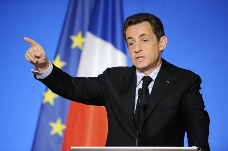 French President Nicolas Sarkozy gestures as he speaks during a press conference on Dec. 14 in Paris, unveiling details of a 35 billion euro national loan to fund a public-spending spree.  (Eric Feferberg/AFP/Getty Images)