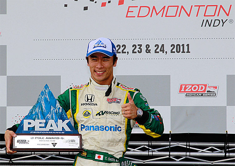 Takuma Sato celebrates winning the pole after qualifying for the IZOD IndyCar Series Indy Edmonton, July 23, 2011. (Chris Trotman/Getty Images)