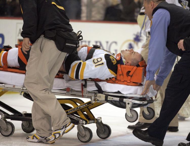Blind side hits like the one that injured Boston Bruins center Marc Savard will not be tolerated next season, per a rule proposed by NHL GMs. (Justin K. Aller/Getty Images)