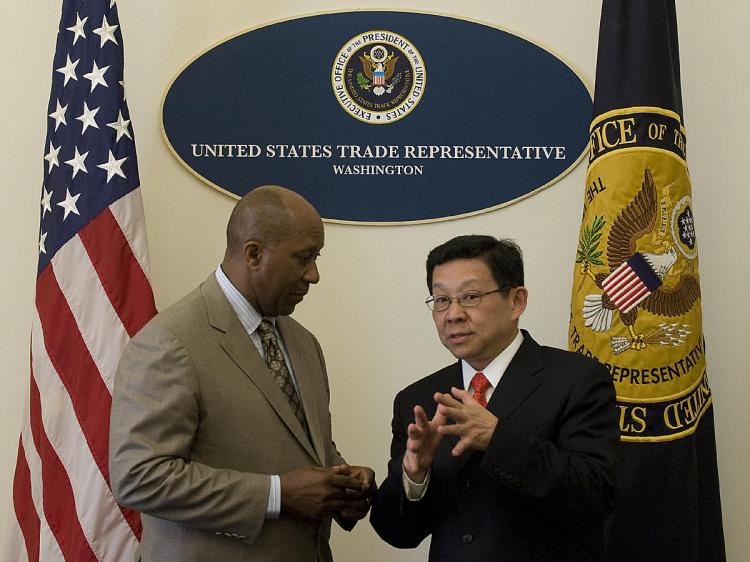 U.S. Trade Representative Ron Kirk (L) speaks with China's Minister of Commerce Chen Deming before a meeting at the US Trade Representative Office in Washington. (Jim Watson/AFP/Getty Images)