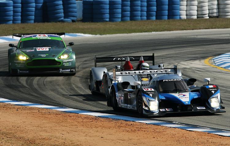 Nicolas Minassian in the #07 Team Peugeot 908 leads Allan McNish in the #2 Audi Sport Team Joest Audi R15 and Jonny Cocker in the #007 Drayson Racing Aston Martin Vantage out of turn five during the 57th Annual Mobil1 12 Hours of Sebring at Sebring Intern (Doug Benc/Getty Images)