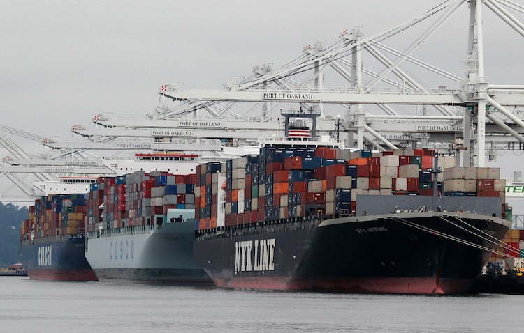 Container ships are positioned under cranes at the Port of Oakland, Calif., on Aug. 16, 2010,  Multinational companies use China as a platform for producing goods to ship back to the United States, which has caused great loss of jobs here. (Justin Sullivan/Getty Images) 