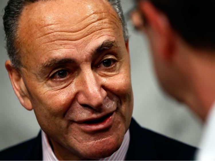 Sen. Chuck Schumer (L) speaks with Sen. Kent Conrad (R) before a markup hearing of the Senate Finance Committee September 30, 2009 in Washington, DC. (Win McNamee/Getty Images)