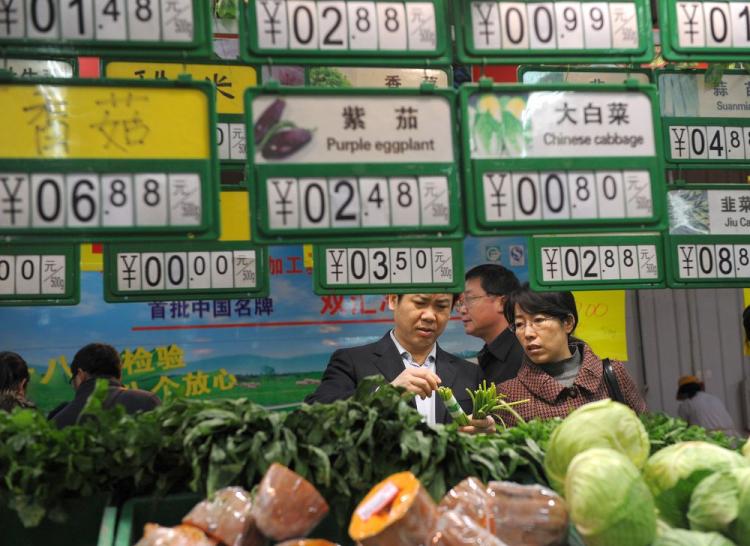 Chinese shoppers gather to buy vegetables at a supermarket in Hefei, east China Anhui province on Dec. 10, 2010. China's consumer prices rose at the fastest pace in more than two years in November. (STR/AFP/Getty Images)