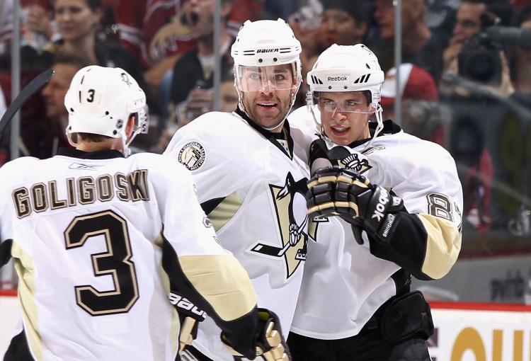 Sidney Crosby #87 of the Pittsburgh Penguins celebrates with teammates Alex Goligoski #3 and Pascal Dupuis #3 after Crosby scored a second period goal against the Phoenix Coyotes on Saturday. Crosby and the Penguins won 4-3. (Christian Petersen/Getty Images)