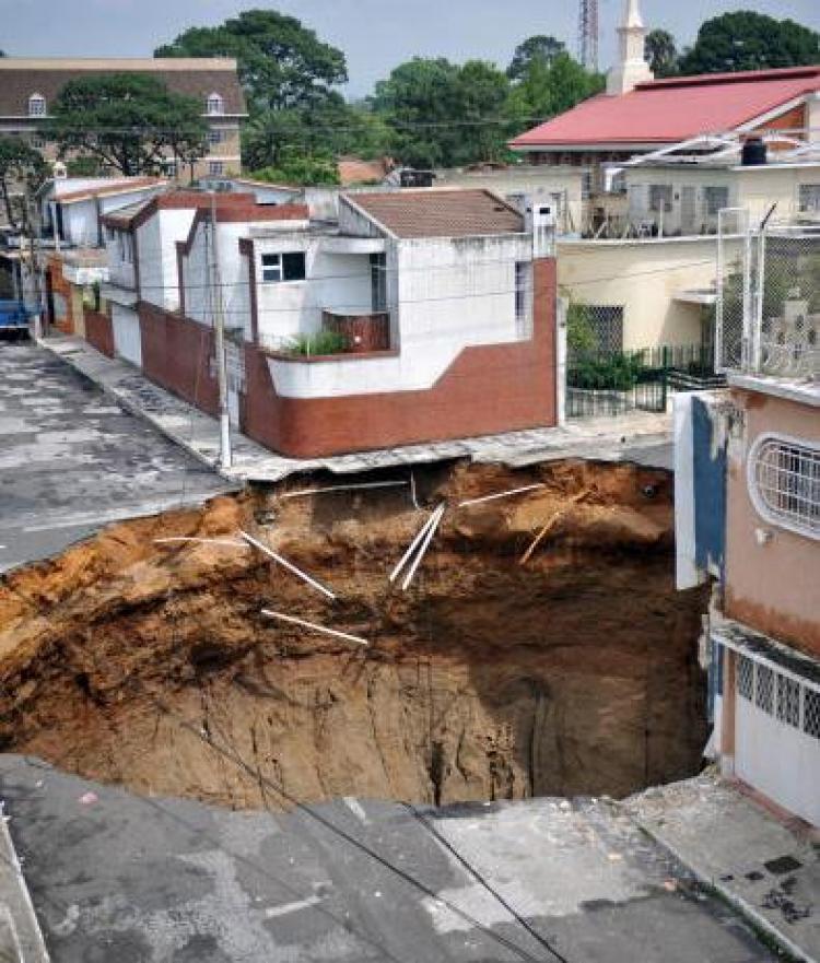 View of a huge crater caused by a landslide due to tropical storm Agatha, in Guatemala City, on May 31, 2010. (Johan Ordonez/AFP/Getty Images)