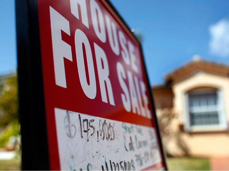 The National Association of Realtors announced that sales of existing homes grew 5.1 percent to an annual rate of 4.72 million last month, from 4.49 million units in January.  (Joe Raedle/Getty Images)