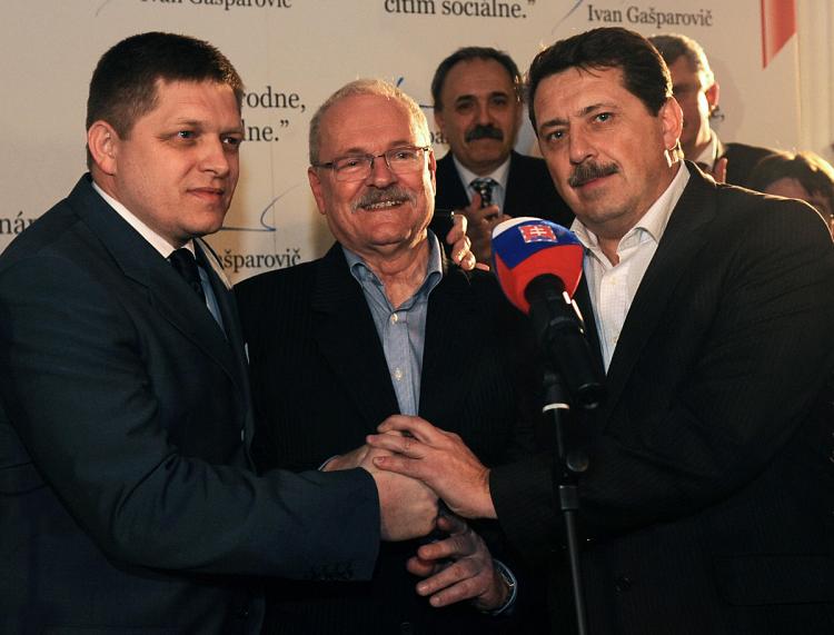 Slovak President Ivan Gasparovic (C) celebrates with Prime minister Robert Fico (L) and speaker of parliament Pavol Paska (R) after the announcement of the first results of Slovakia's presidential election.  (Samuel Kubani/AFP/Getty Images)