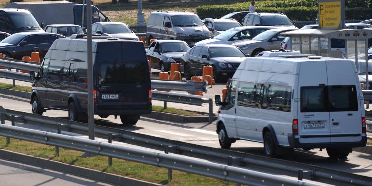 Vans carrying Russian agents deported from the US, leave Domodedovo airport in Moscow on July 9. Russia and the US played out their biggest spy swap since the Cold War at Vienna airport, exchanging 10 agents deported by US authorities for four jailed in Russia.  (Alexander Blotnitsky/Getty Images)