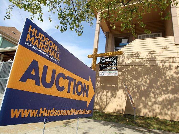 A sign advertising an auction is posted in front of a foreclosed home April 15, 2010 in Oakland, California. (Justin Sullivan/Getty Images)