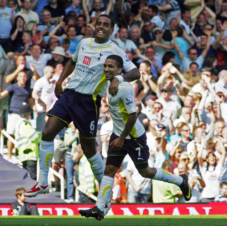 TOP OF THE TABLE: Spurs' Tom Huddlestone (left) and Aaron Lennon celebrate the game winner against West Ham on Sunday. (Geoff Caddick/AFP/Getty Images)