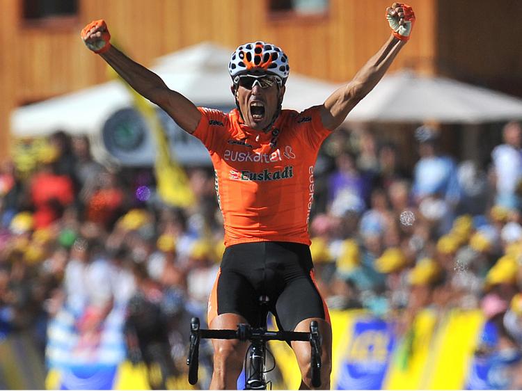 Euskatel-Euskadi's Mikel Astarloza jubilates on the finish line as he wins Stage Sixteen of the 2009 Tour de France. (Lionel Bonaventure/AFP/Getty Images)