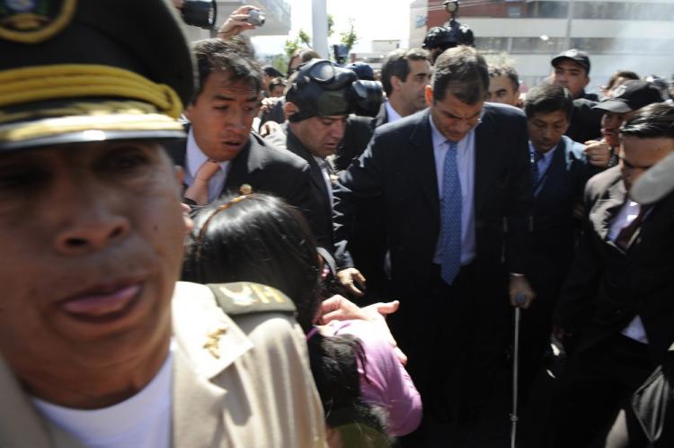 State of Siege: Ecuadorean President Rafael Correa (C) arrives at Regimiento Quito barracks in Quito on Sept. 30. (Rodrigo Buendia/AFP/GETTY IMAGES)