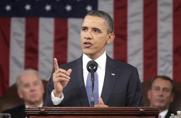 U.S. President Barack Obama (C), flanked by Vice President Joe Biden (L) and Speaker of the House John Boehner (R-Ohio), delivers his State of the Union address on Capitol Hill on Tuesday, Jan. 25 in Washington, DC. (Pablo Martinez Monsivais-Pool/Getty Images)