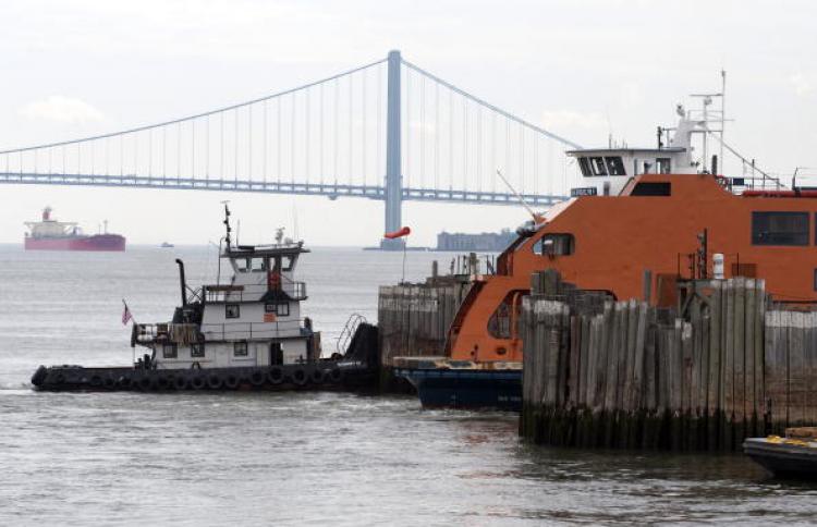 Staten Island Ferry Crash: A tug boat stands ready by the Staten Island Ferry Andrew J. Barberi which crashed May 8 into a pier at the dock on Staten Island. (Don Emmert/AFP/Getty Images)
