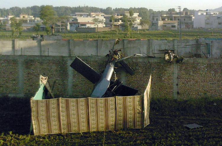 Stealth helicopter? A crashed military helicopter is seen near the hideout of al-Qaeda leader Osama bin Laden after a ground operation by U.S. Special Forces in Abbottabad, Pakistan on May 2. (STR/AFP/Getty Images)