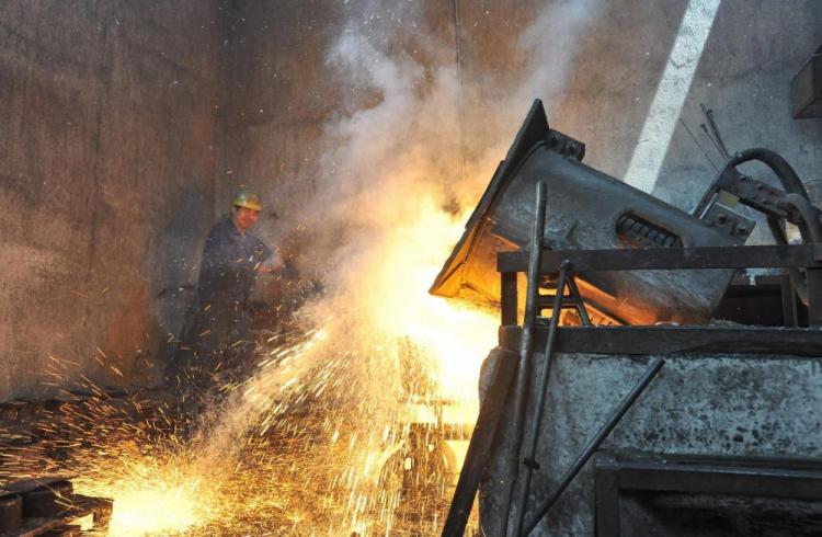 A steel worker watches over a furnace at an iron-steel factory in Wuhan, central China's Hebei province. China's GDP growth is dominated by government investment, which in many areas is worryingly high. (STR/AFP/Getty Images)