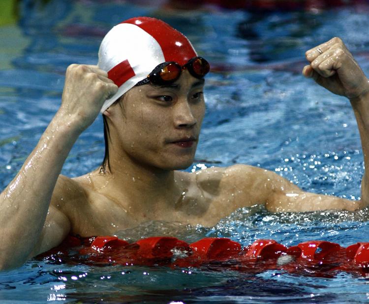 Chinese swimmer Ouyang Kunpeng has been suspended for life for use of performance-enhancing drugs. (Antony Dickson/AFP/Getty Images)