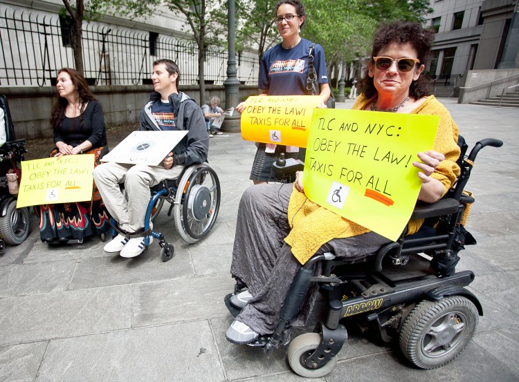 ACCESS: Advocates for wheelchair accessible taxis gathered at U.S. District Court in Lower Manhattan on Tuesday.  (Amal Chen/The Epoch Times)