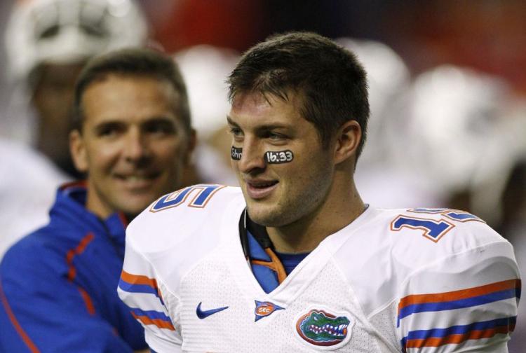 SEC CHAMPS: Tim Tebow receives the MVP award after his Florida Gators beat the Alabama Crimson Tide in the SEC Championship. Florida will face Oklahoma in the National Championship game on Jan. 8. (Kevin C. Cox/Getty Images)