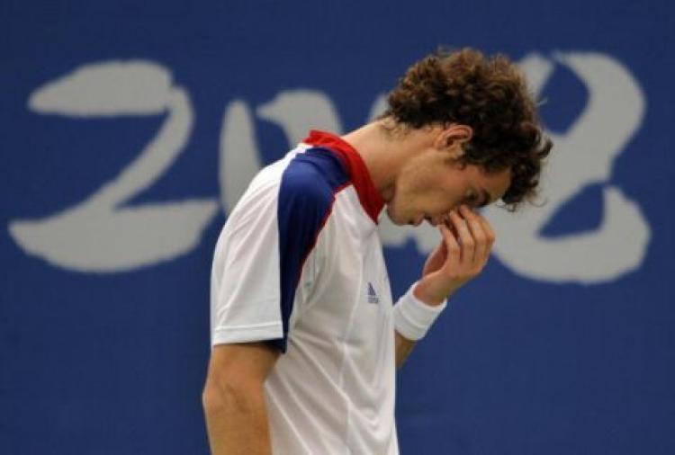World No. 6 Seed Andy Murray of Great Britain takes a breath after a rough start against Taiwanese Lu Yen-Hsun in the first round of the 2008 Olympic Games on August 11. Murray lost the match 7-6, 6-4.  (Pedro Ugarte/AFP/Getty Image)
