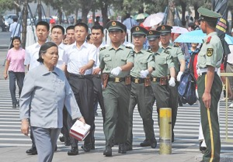 Chinese paramilitary police march into Tiananmen Square in Beijing on June 4, 2008. China has stepped up security in central Beijing ahead of the Olympics. ()