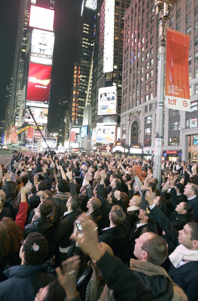 Excited viewers follow the election results on a screen at Times Square on Election Day. (Edward Dai/Epoch Times)
