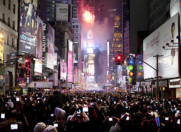 Ball Drop 2011: Times Square lights up at midnight EST, announcing 2011 in New York City. (Edward Dai/The Epoch Times)