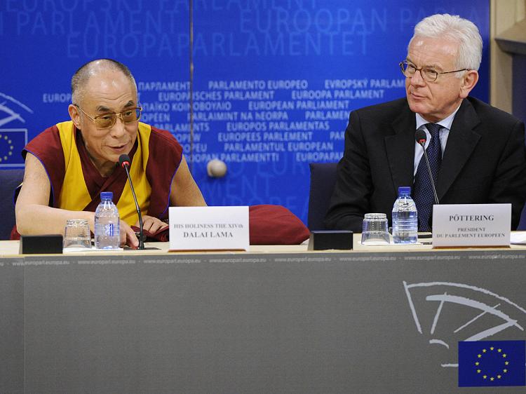 European Parliament President Hans-Gert Poettering (R) and exiled Tibetan spiritual leader Dalai Lama speak to the press at the EU Parliament in Brussels on December 4, 2008. (John Thys/AFP/Getty Images)