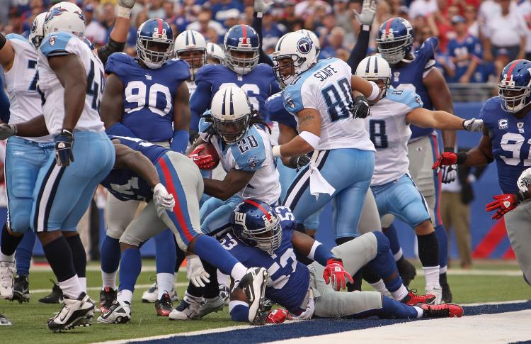 Chris Johnson (No. 28) of the Tennessee Titans gets his first of two touchdowns against the New York Giants at the New Meadowlands on Sunday. (Mike Ehrmann/Getty Images)