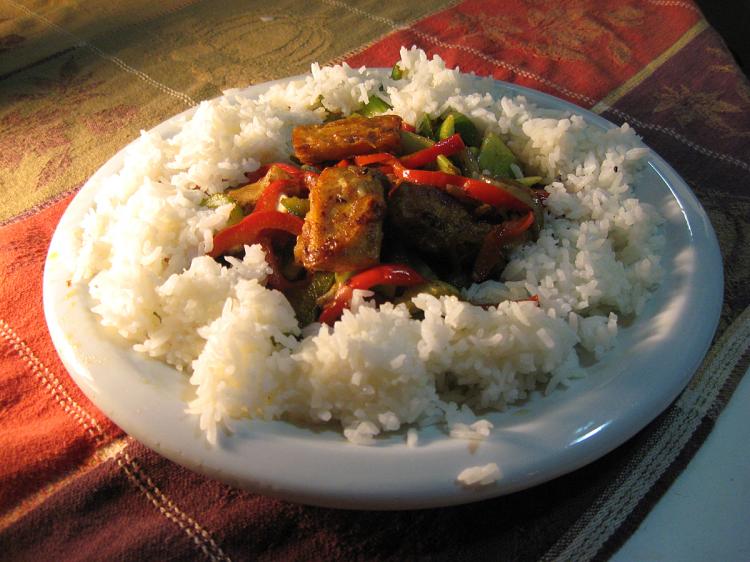 COOKING TOFU: Cut tofu in 1-inch cubes and roll in flour or cornstarch. (Maureen Zebian/The Epoch Times)