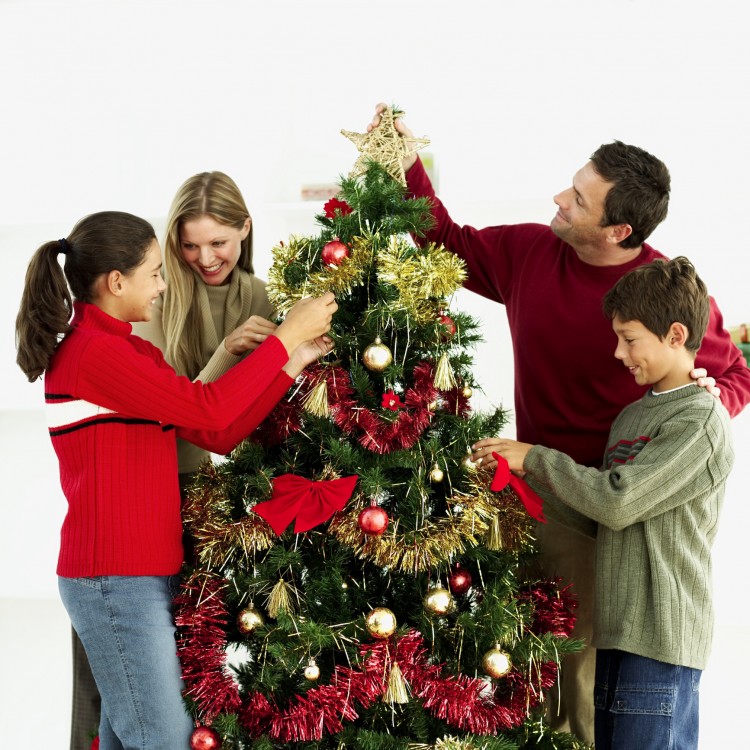 Dress the tree with loved ones after making over your home. (George Doyle/Photos.com)