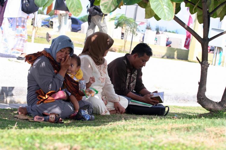 A family at the Ulee Lheue port in Banda Aceh last Friday remembers their loved ones killed during the tsunami in 2004. December 26 marked four years since the deadly Indian Ocean tsunami. (Mikael Onny Setiawan/AFP/Getty Images)