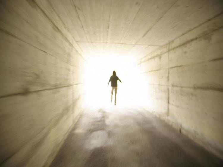 Many people who came close to death told of experiences of passing through a tunnel into a bright light.  (Photos.com)