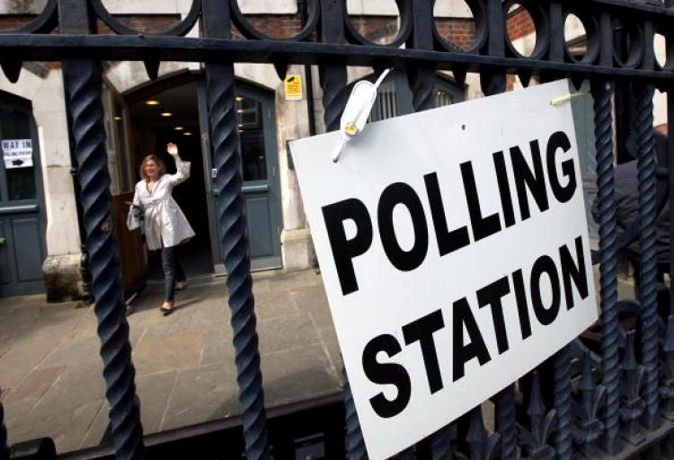 British Election Exit Poll: A woman leaves a polling station on Brick Lane after casting her vote on May 6, 2010 in London, UK. (Dan Kitwood/Getty Images)