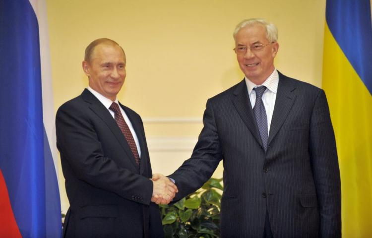 Ukraine's Prime Minister Mykola Azarov (R) welcomes his Russian counterpart Vladimir Putin prior their talks in Kyiv late April 26, 2010. (Sergei Supinsky/AFP/Getty Images)