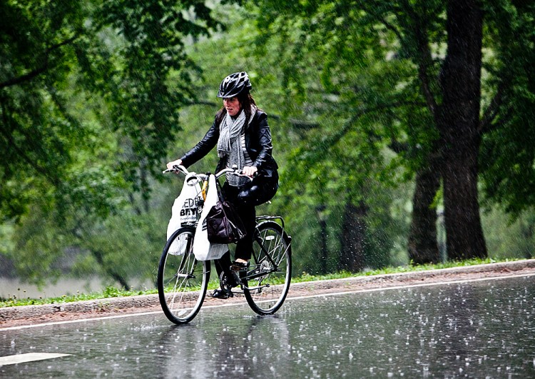 A cyclist rides in Central Park in the rain in Manhattan on May 18, 2011. (Amal Chen/The Epoch Times)