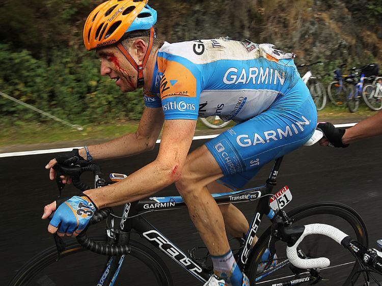 Christian VandeVelde rides to the end of Stage Two of the 2010 Tour de France with cuts, bruises, and broken bones. (Spencer Platt/Getty Images)