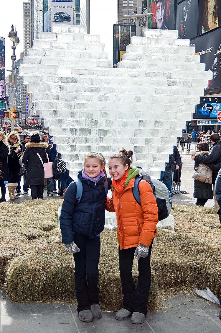 COOL HEART: Tourists in Times Square gathered around a ten-foot heart constructed of blocks of ice on Sunday Feb. 14. The heart was created by two architect brothers, Robert and Granger Moorhead. (Aloysio Santos/The Epoch Times)