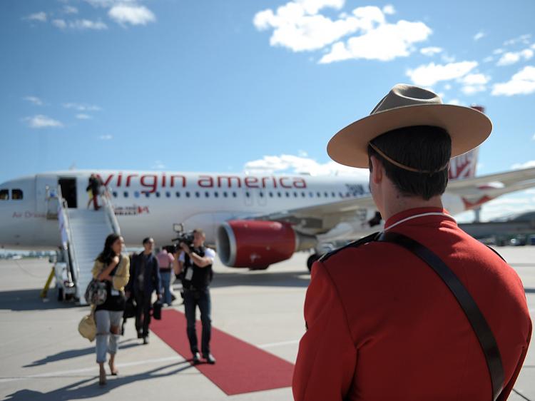 Virgin America's first international flight to Toronto after arriving at Toronto Pearson International Airport on June 29. Virgin America is celebrating its Best Domestic Airline win at the Travel & Leisure Magazine Best Awards on July 8 with a seat sale. (Michael Buckner/Getty Images)