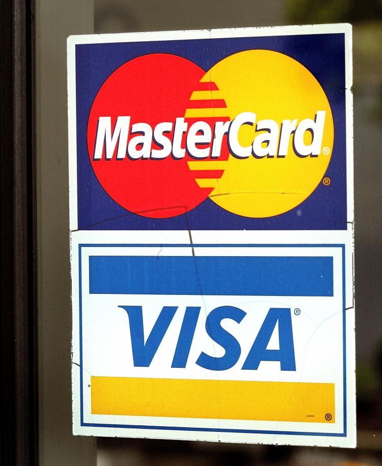 Visa and Mastercard settled an antitrust suit with the US Department of Justice on Monday. (Tim Boyle/Getty Images)