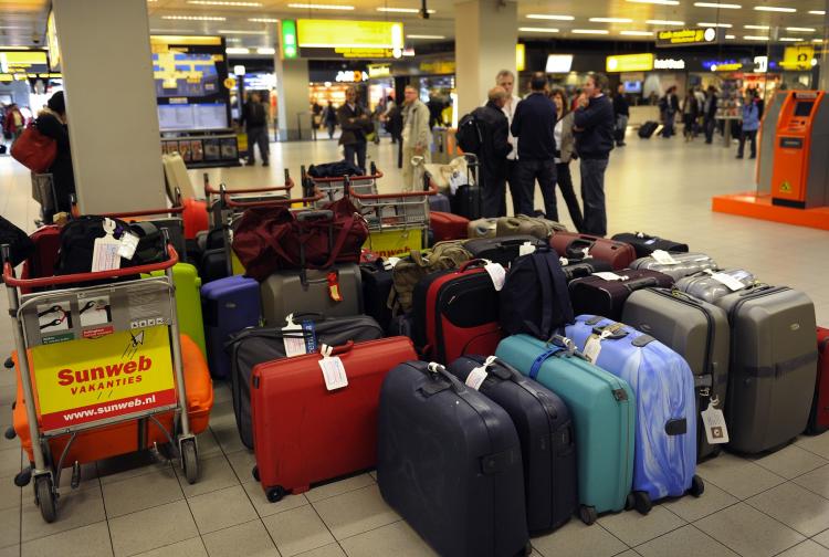 Passengers wait after flights were cancelled at the Schiphol Airport, outside Amsterdam on May 17, 2010.  (Toussaint Kluiters/AFP/Getty Images)